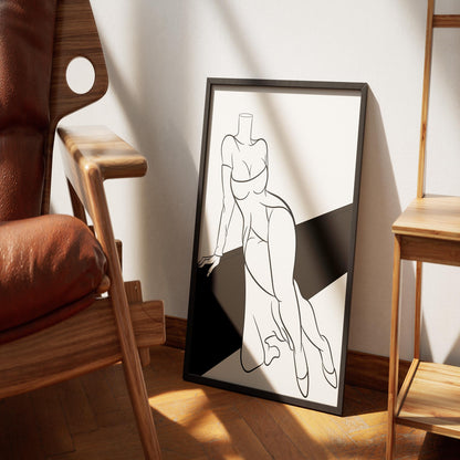 Line art depicting off-shoulder dress, framed, leaning against wall; ideal for art lovers and designers.