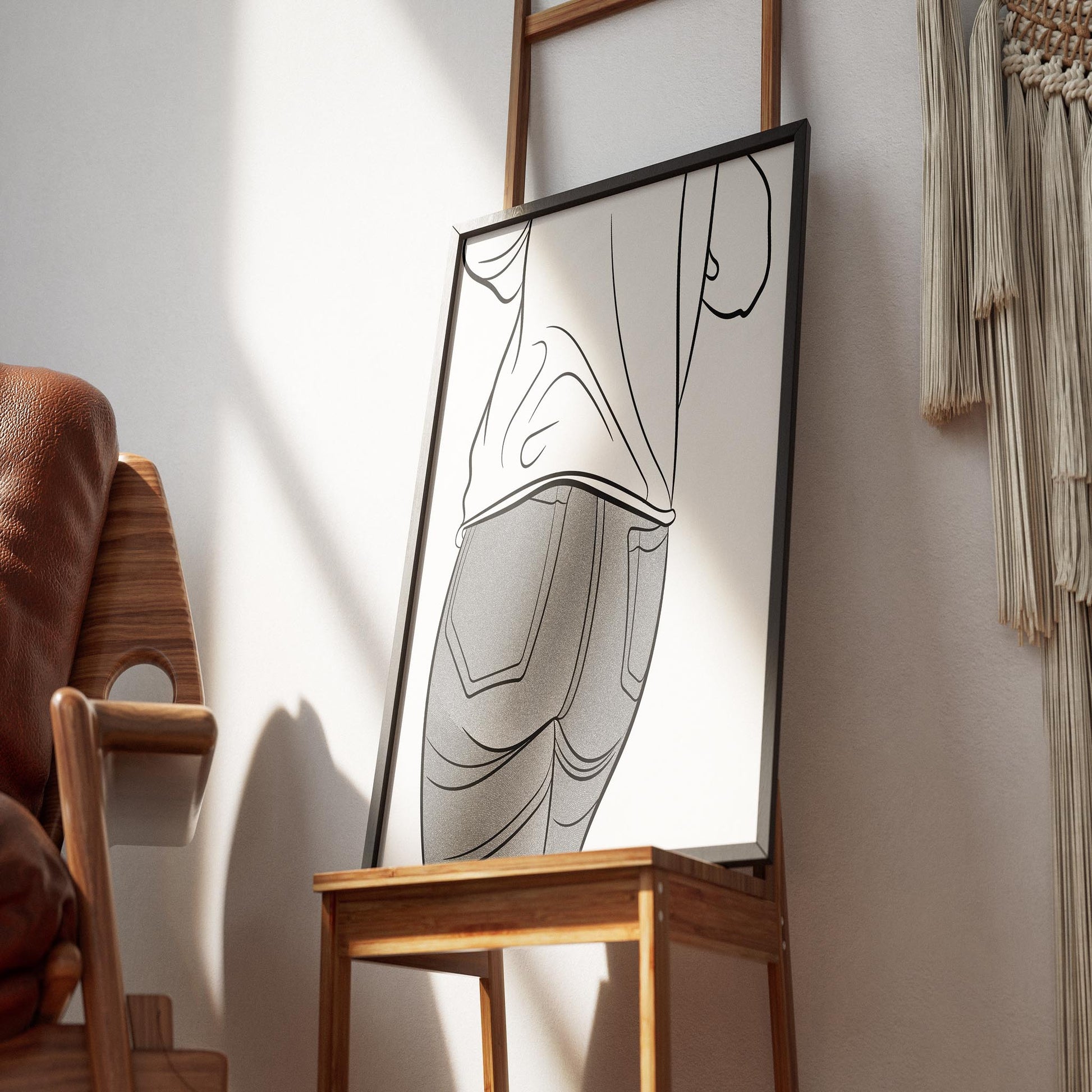 Framed line art of jeans displayed on an easel, showcasing Denim Model 49 by Digitalized Arts.