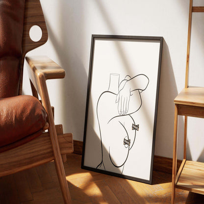 Model 60 - Line Art digital artwork in a frame on a wooden floor, featuring bold curves and clean lines.