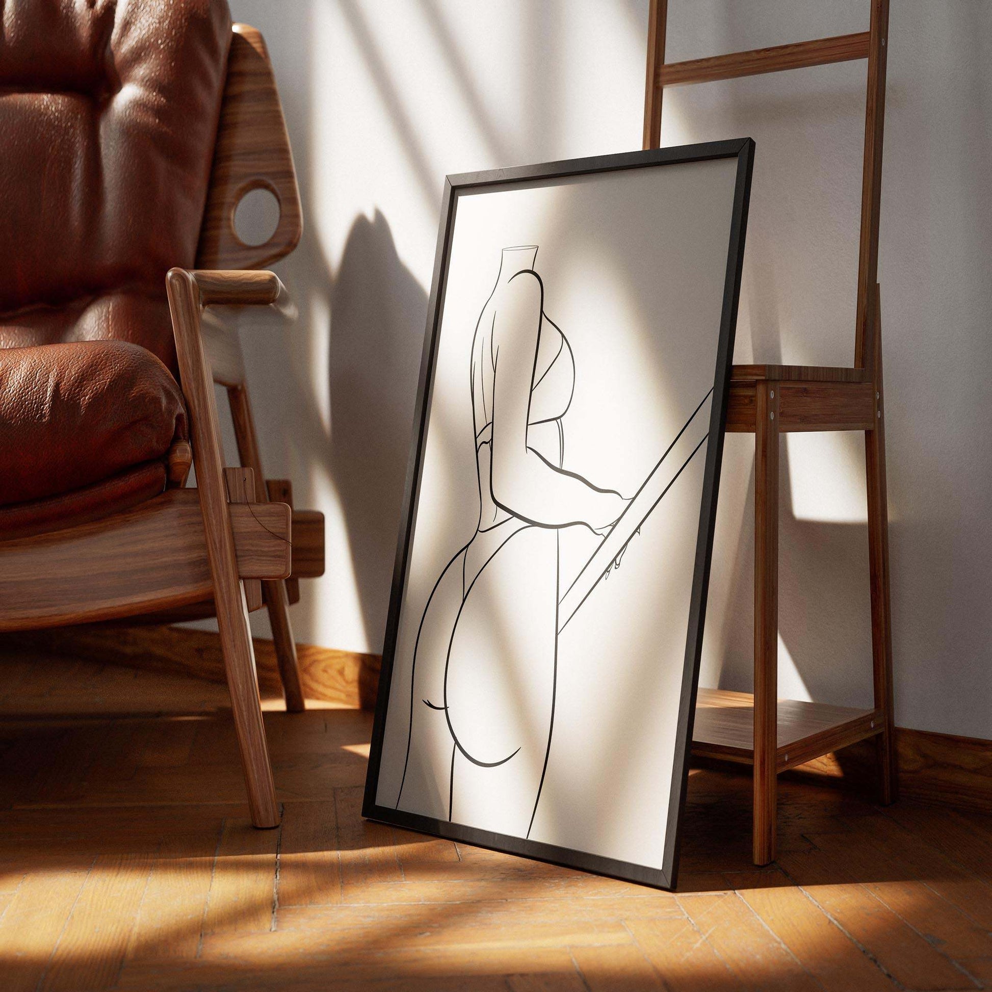Digitalized Arts Model 7 - Line Art framed poster on wooden floor by armchair.